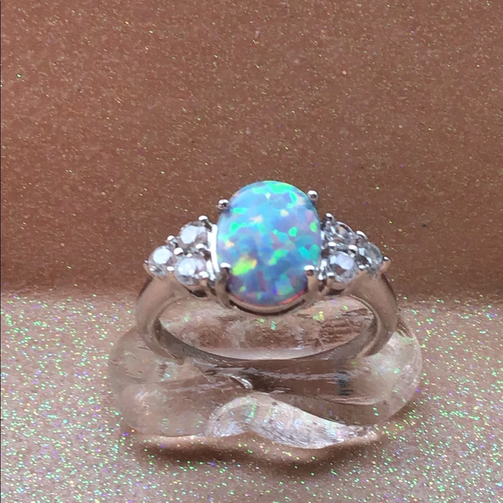 One ladies simulated opal ring.